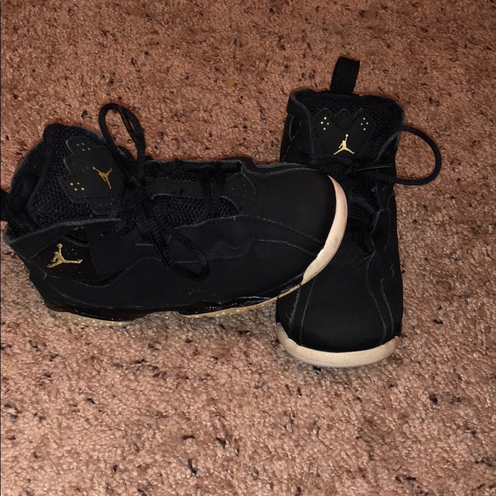 Toddler size 10 black and gold Jordan